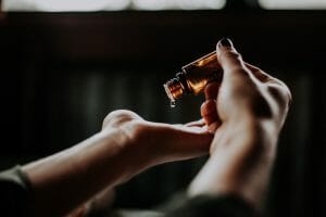 5 New and Innovative Ways to Take CBD 5 oil dripping onto persons hand